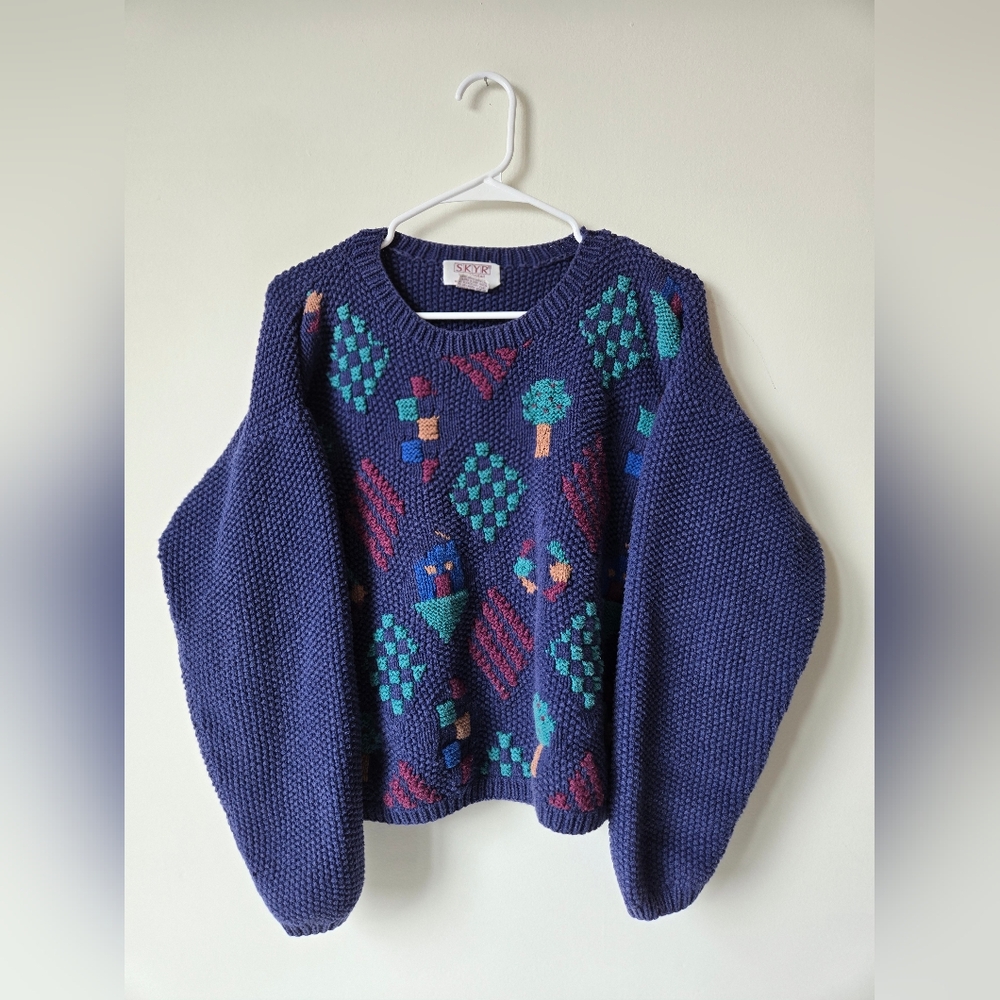 Cozy purple sweater with colorful details